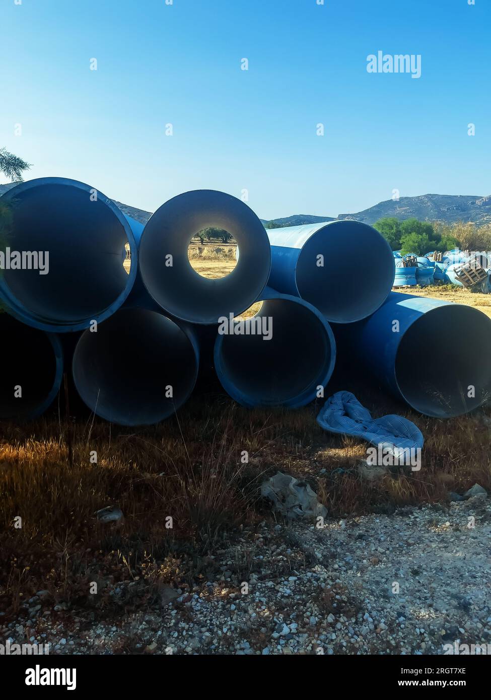 Pipes for pumping or pumping water in the artificial lake Bramiana on the island of Crete, Greece. Stock Photo