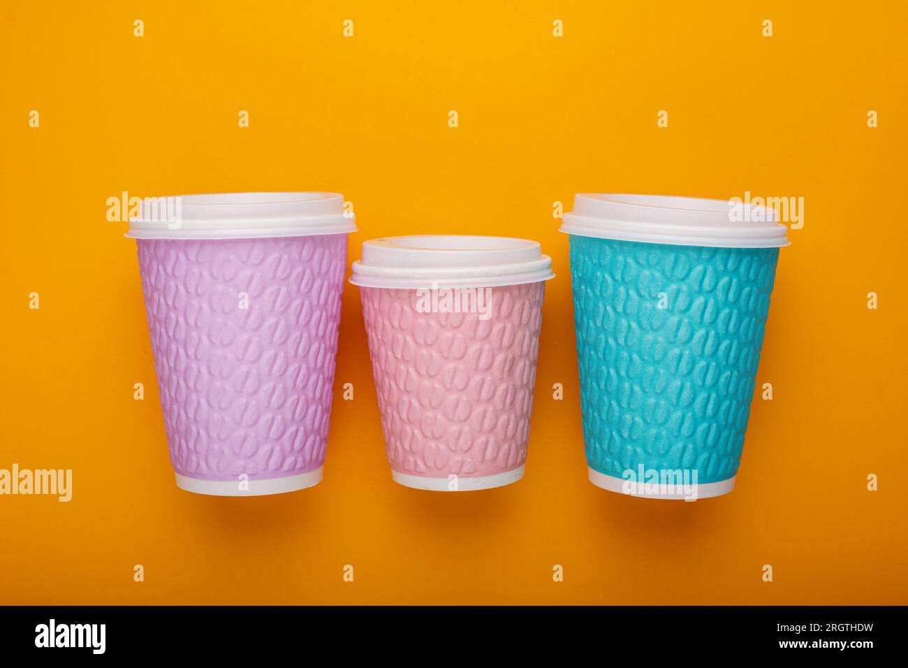 Colored cardboard coffee cups on a bright background Stock Photo Alamy