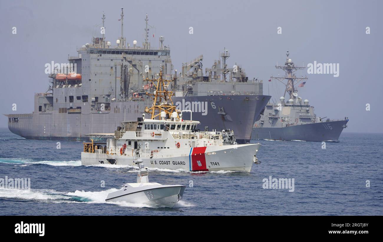 An L3 Harris Arabian Fox MAST-13 unmanned surface vessel, U.S. Coast Guard fast response cutter USCGC Charles Moulthrope (WPC 1141), dry cargo and ammunition ship USNS Amelia Earhart (T-AKE 6) and guided-missile destroyer USS Thomas Hudner (DDG 116) sail together during a transit through the Strait of Hormuz, on August 6, 2023. Photo via U.S. Navy/UPI Credit: UPI/Alamy Live News Stock Photo