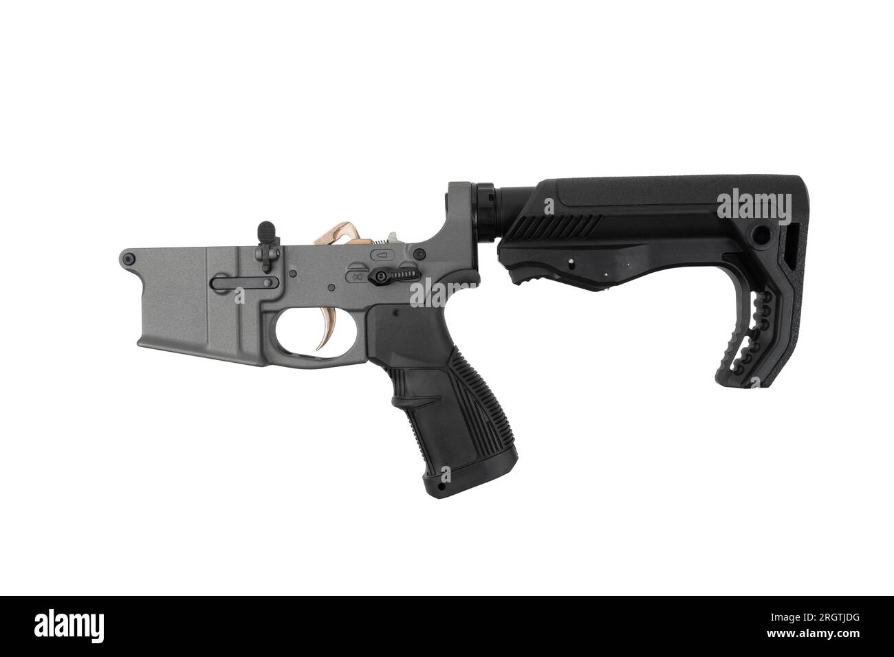 AR15 lower receiver iand buffer spring. Bottom half of a modern assault rifle. Isolate on white background. Stock Photo