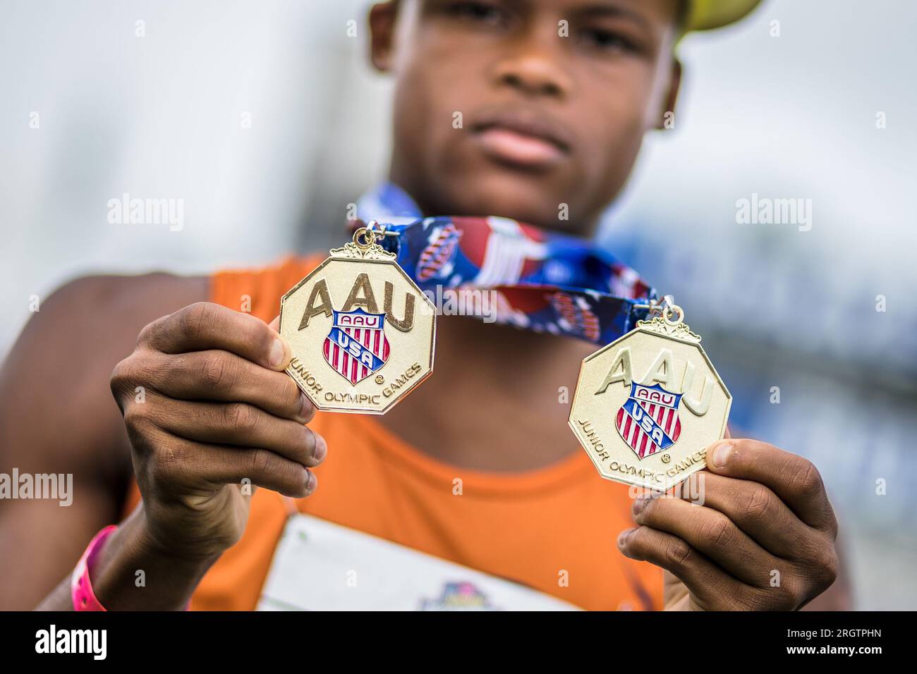 August 4, 2023 Ian Hill of Pearland Track Xpress holds his gold medals during the 2023 AAU