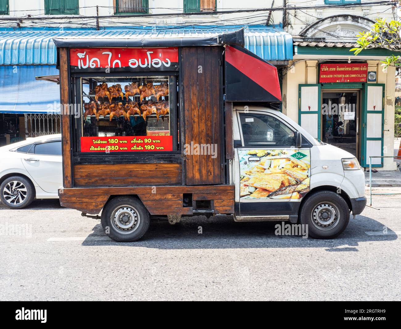 Bangkok Thailand 2 18 2023 A Street Side Food Truck In Bangkok   Bangkok Thailand 2182023 A Street Side Food Truck In Bangkok Thailand Showcases Wooden Accents And Offers Delicious Roasted Chicken 2RGTRH9 