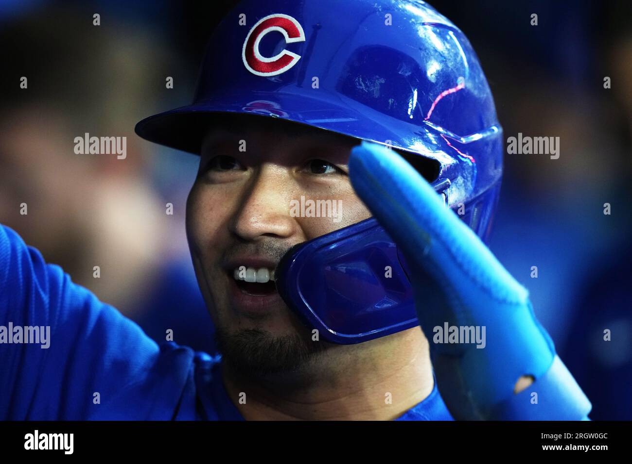 Chicago Cubs Seiya Suzuki celebrates after scoring against the Toronto Blue Jays during the fourth inning of a baseball game Friday, Aug