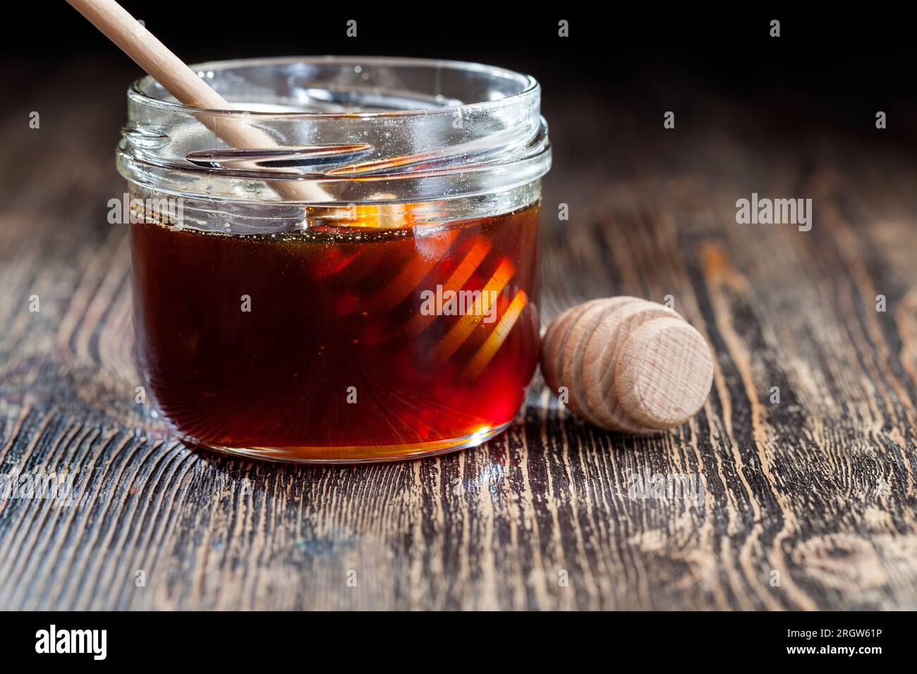 thick and sweet buckwheat honey of dark red color from buckwheat