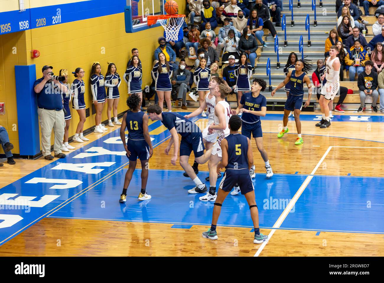 Central Noble and Hammond Noll players await the rebound after a shot in a high school basketball game in North Judson, Indiana, USA. Stock Photo