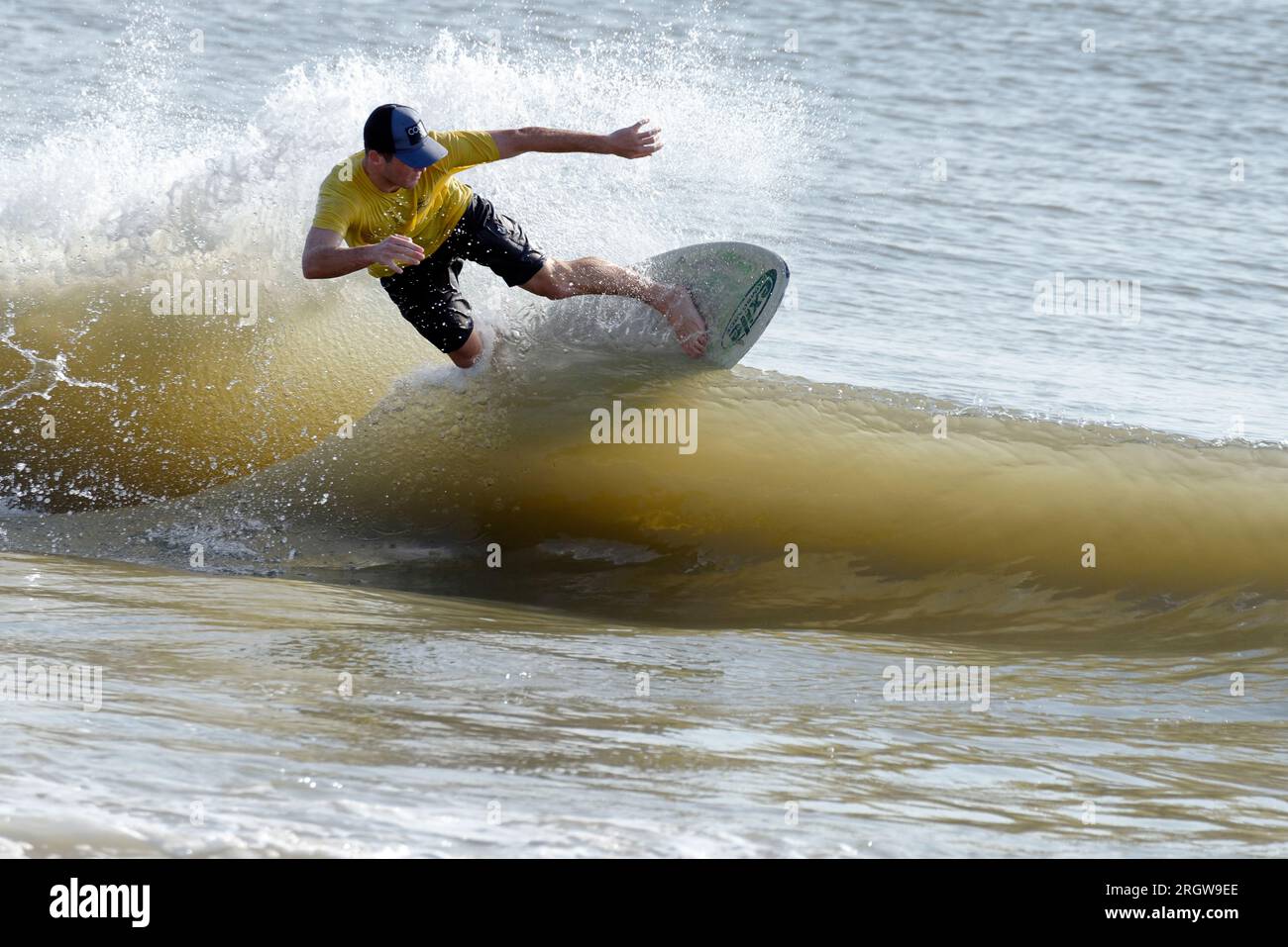 Contestant rides for points during heat at the Zap Pro/Am Championships of Skimboarding, August 11, 2023, Dewey Beach, Delaware USA. Stock Photo