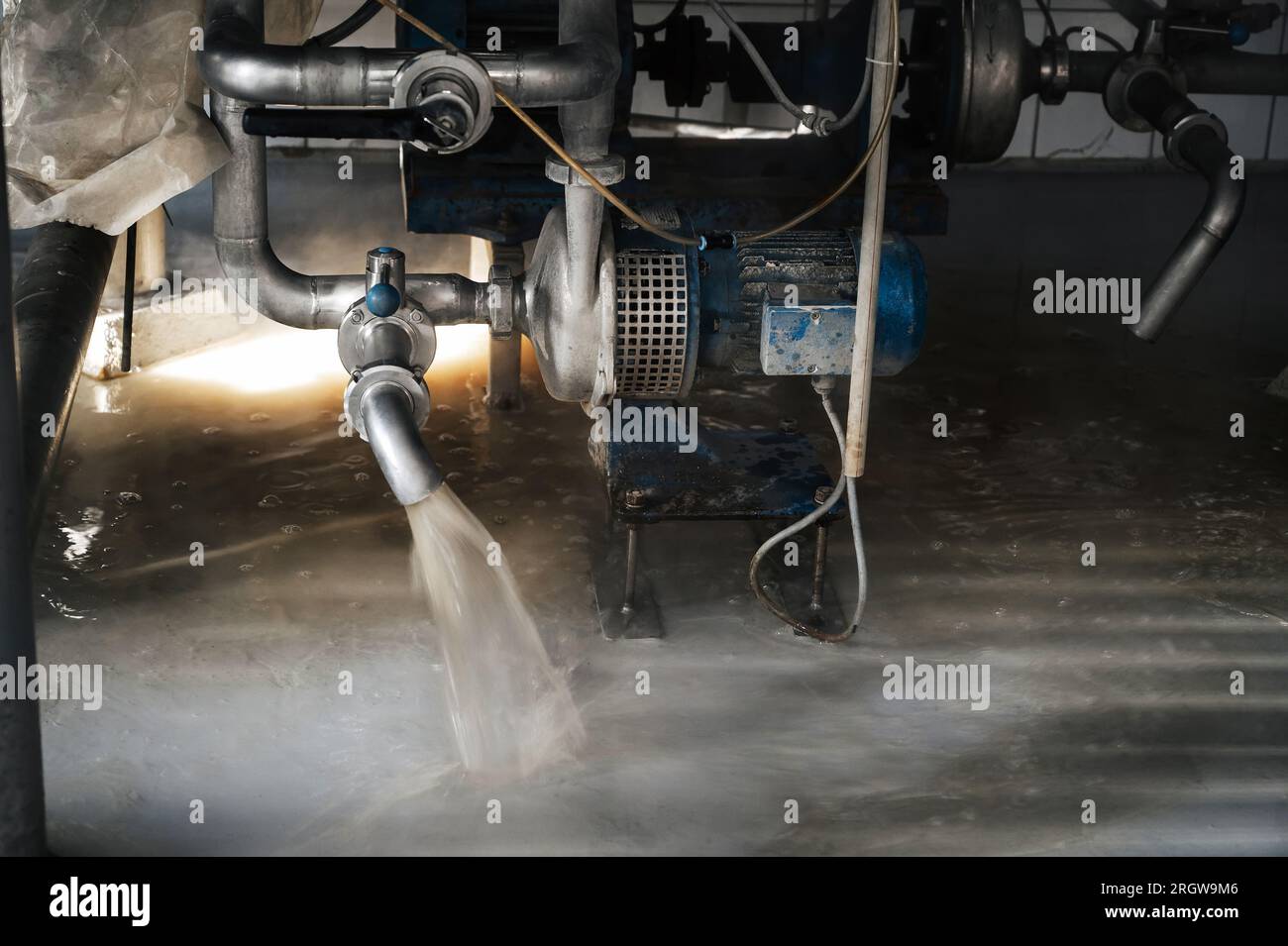equipment with a pump draining water from a tank at a beer factory