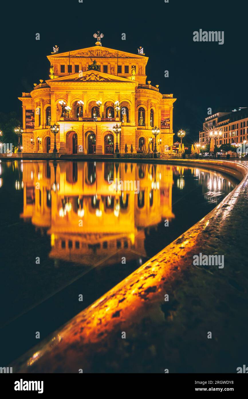 The Alte Oper in Frankfurt, beautiful opera house in Germany in the middle of the city in the evening and illuminated Stock Photo