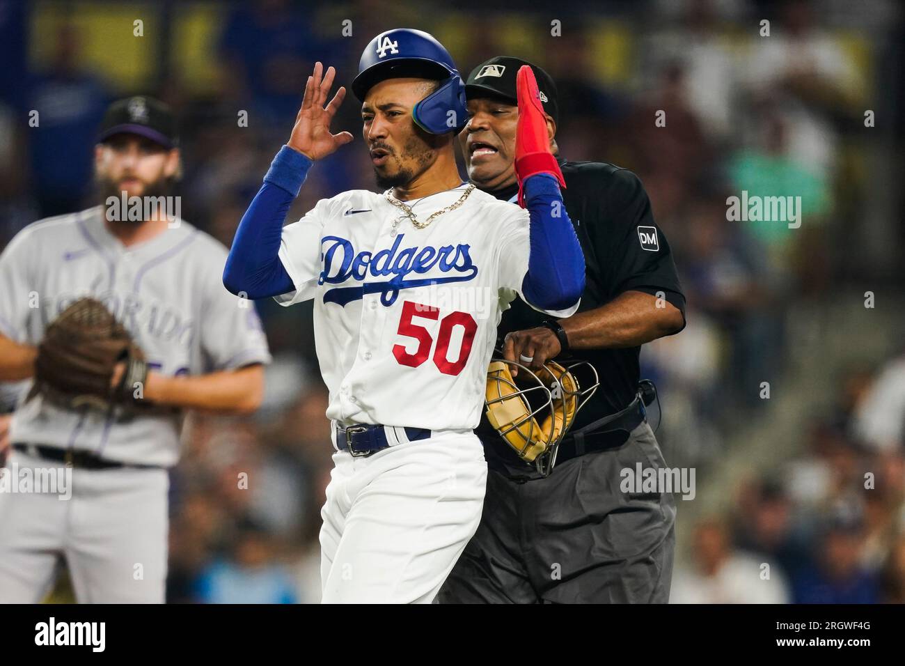 Los Angeles Dodgers' Mookie Betts (50) reacts after getting caught trying  to steal home by Colorado Rockies catcher Elias Diaz during the sixth  inning of a baseball game Friday, Aug. 11, 2023