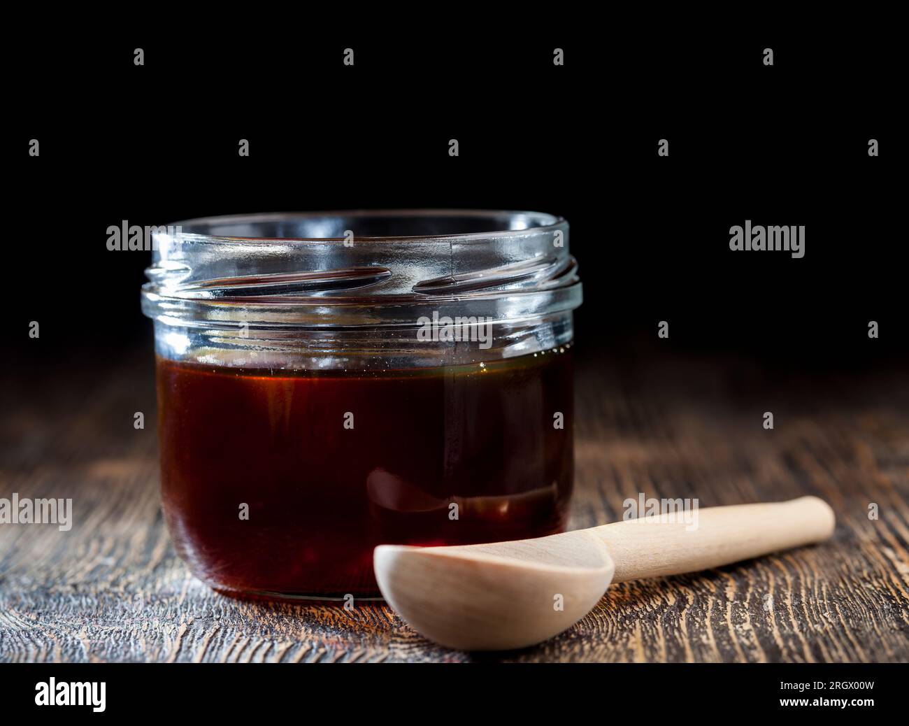 thick and sweet buckwheat honey of dark red color from buckwheat