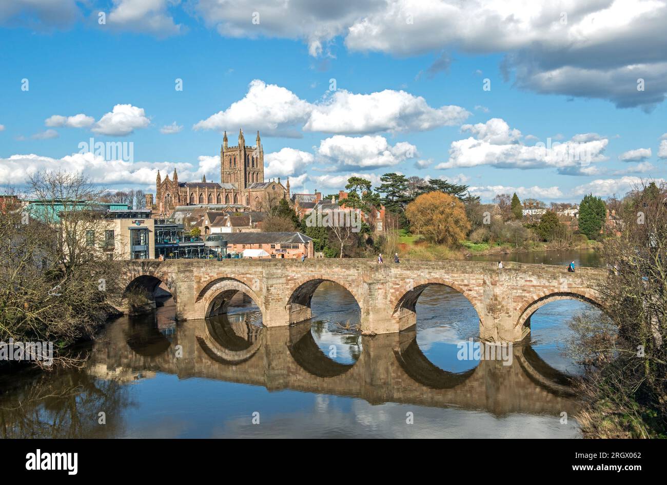 Hereford Cathedral and St. Martin's Street Bridge with its five famed arches  over the River Wye on a sunny Spring day in March Stock Photo