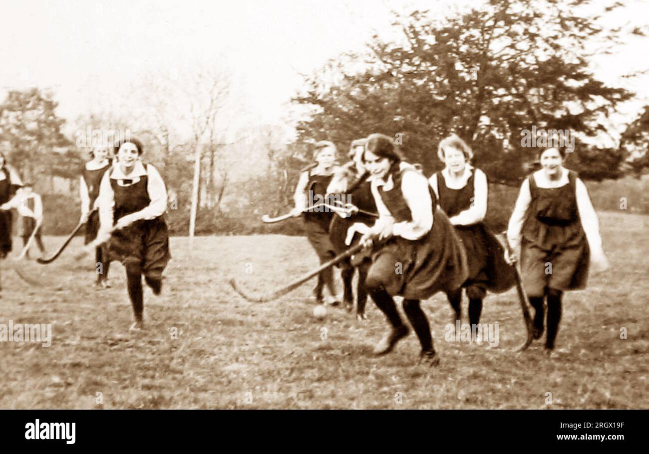 Girls playing Shinty, probably 1920s Stock Photo