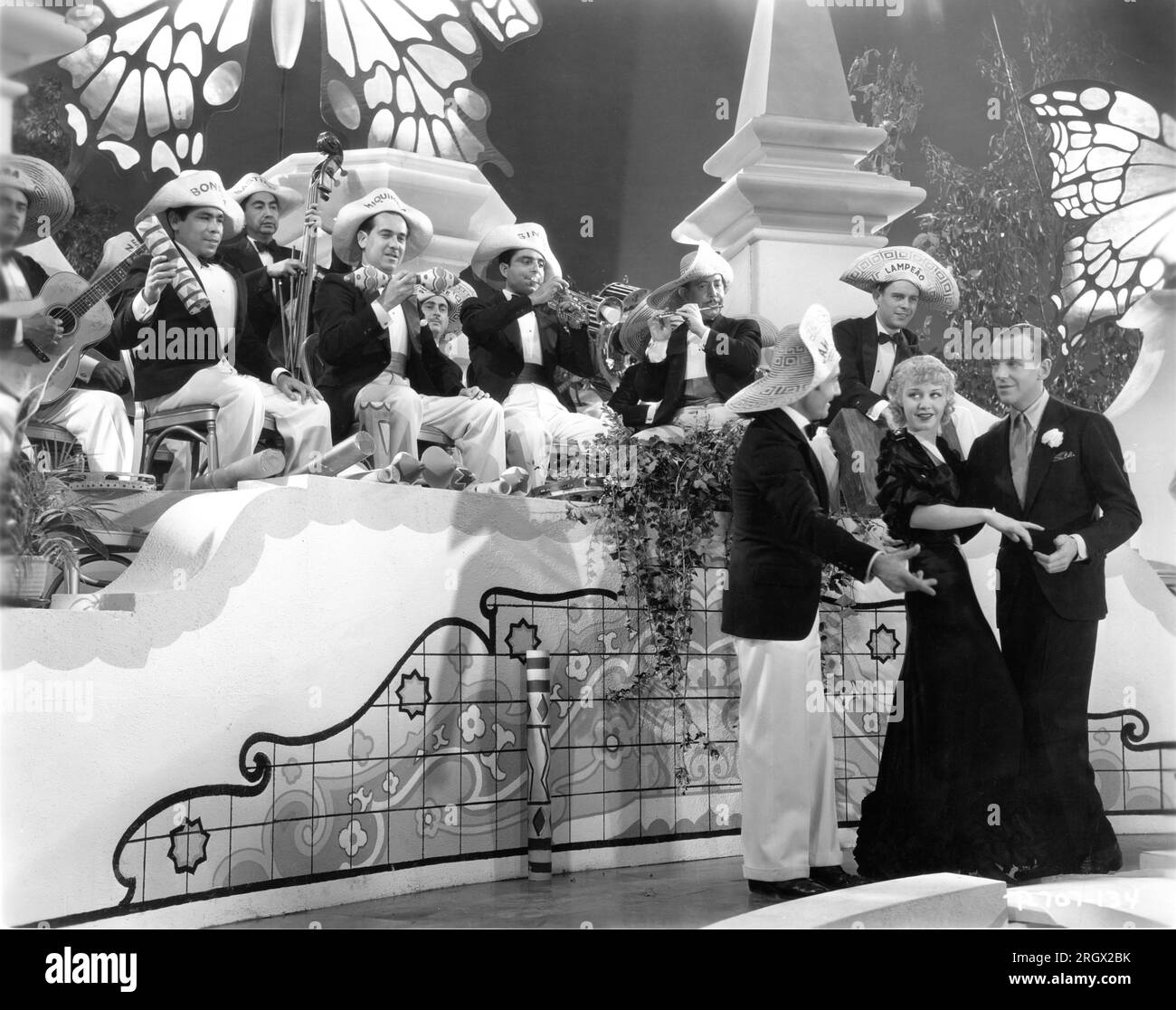 FRED ASTAIRE and GINGER ROGERS dancing the Carioca in FLYING DOWN TO RIO 1933 director THORNTON FREELAND music Vincent Youmans lyrics Gus Kahn and Edward Eliscu costumes Walter Plunkett and (uncredited) Irene RKO Radio Pictures Stock Photo