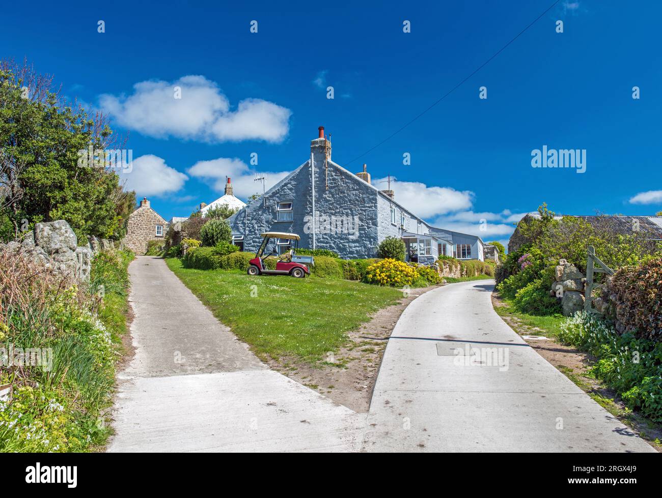 St Agnes Island  - part of the Isles of Scilly. This photo shows not only the deep blue sky but also the dividing of the roads to make life easier. Stock Photo