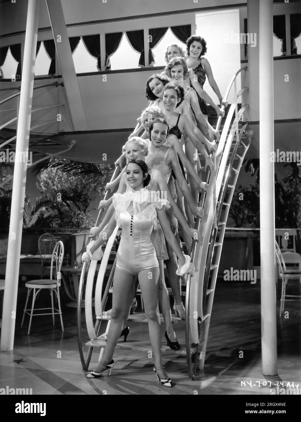 MOVITA CASTANEDA (front) and other Chorines / Chorus Girls pose on the Dirigible nightclub set publicity for FLYING DOWN TO RIO 1933 director THORNTON FREELAND music Vincent Youmans lyrics Gus Kahn and Edward Eliscu costumes Walter Plunkett and (uncredited) Irene RKO Radio Pictures Stock Photo