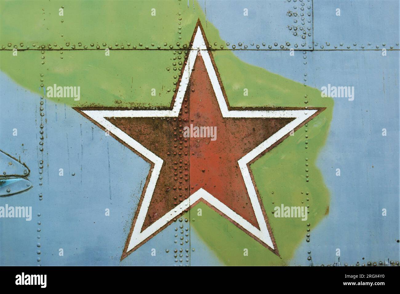 The symbol of the Soviet Union is a red star. A star on the fuselage of an old military helicopter. Stock Photo