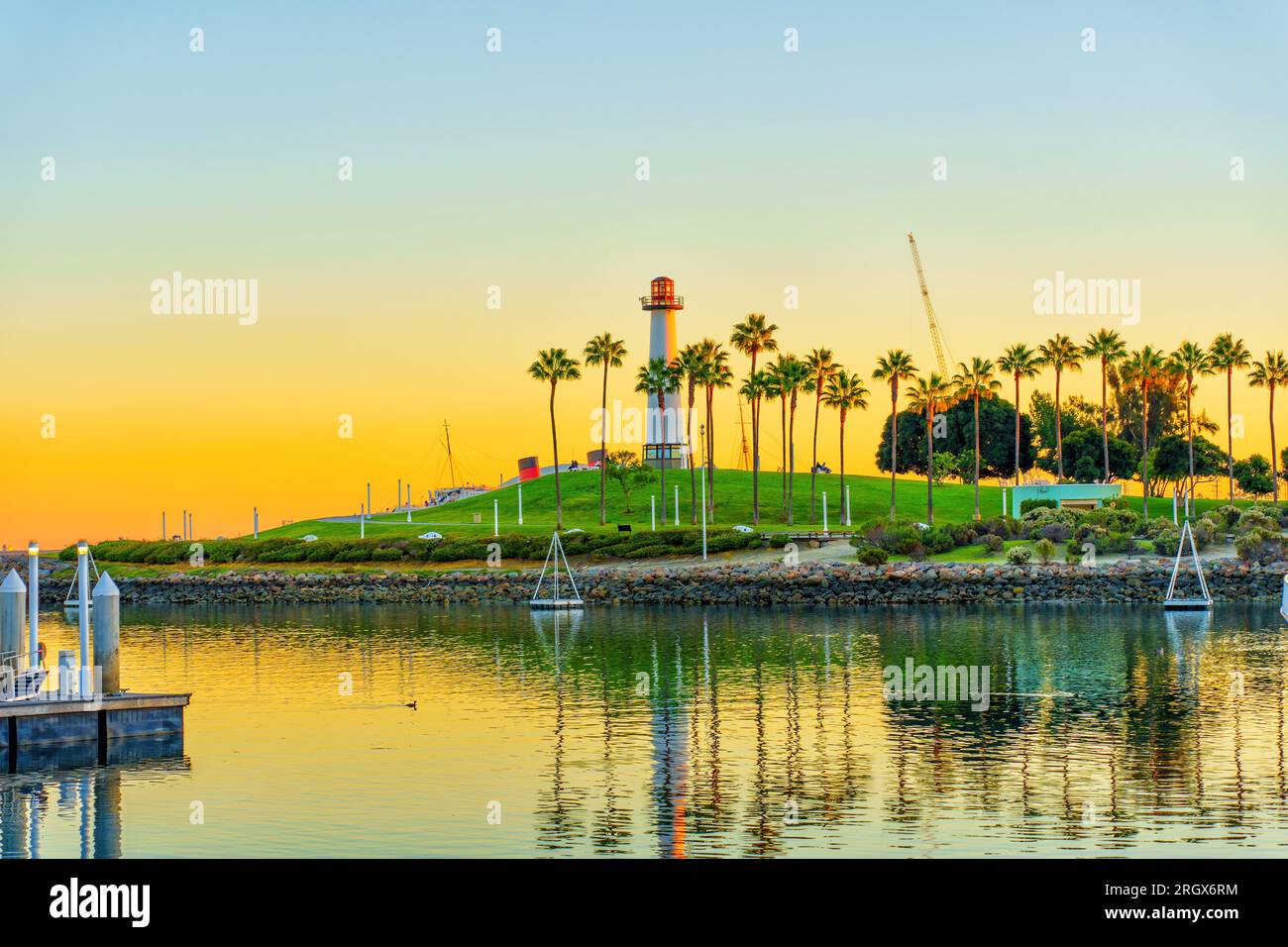 Waterfront view of the Lions Lighthouse area on Long Beach basking in the warm gradients of the setting sun. Stock Photo