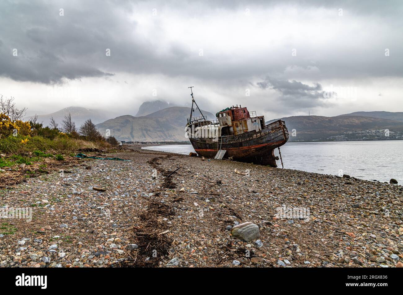 An old beached trawler; the old boat of Caol Stock Photo - Alamy