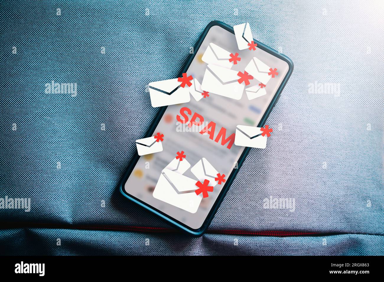 Top lay photo of smartphone with hologram mail spam concept. Communication business technology. Protect spam mail from internet cyber security. Stock Photo