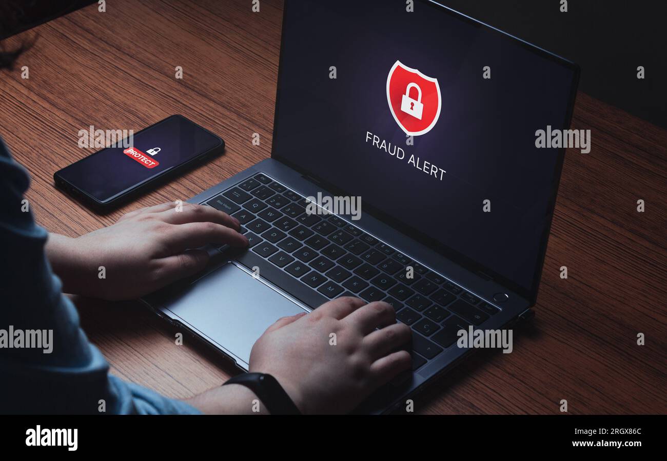 Woman use digital tablet with system hacked alert VR screen. Compromised information concept. Internet virus cyber security and cybercrime. Stock Photo