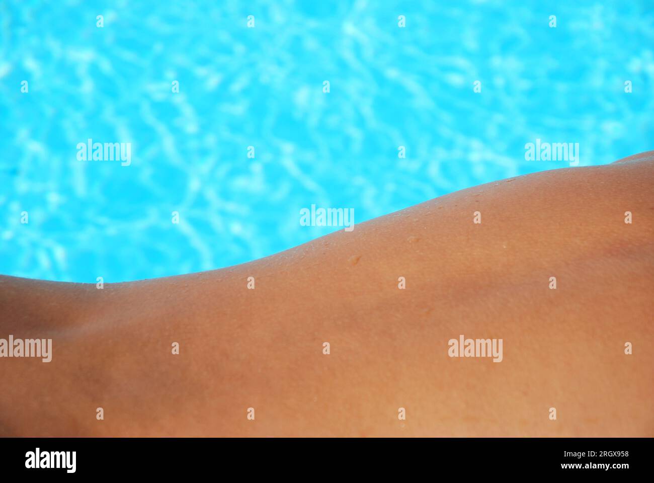 Composition: back and water of swimmingpool. Stock Photo