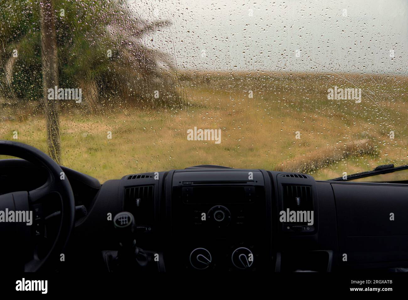 background of texture of raindrops on the glass in wintertime. Storm in rainy day and bad weather Stock Photo
