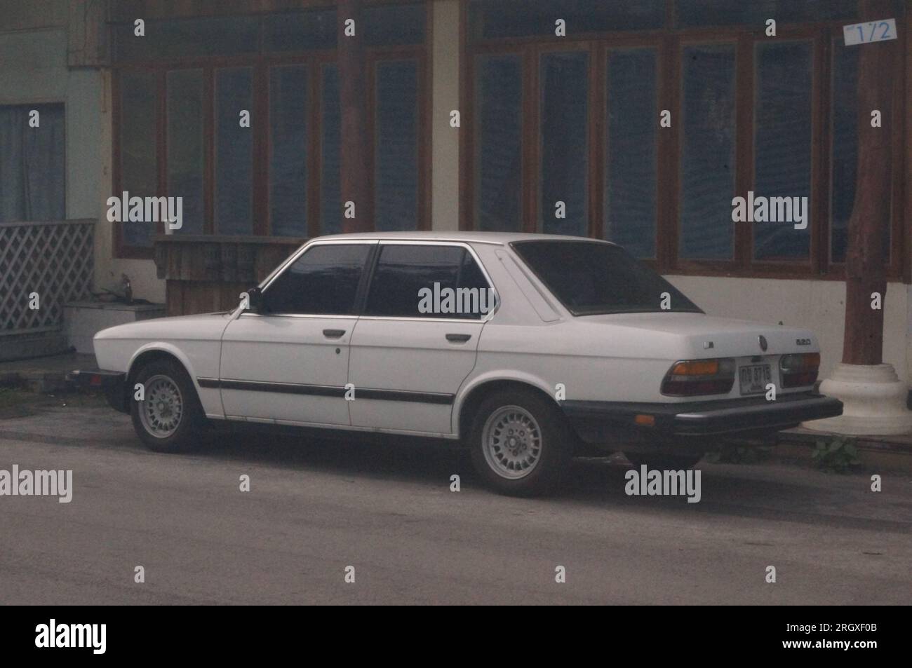 A classic white retro car in an urban town Stock Photo - Alamy