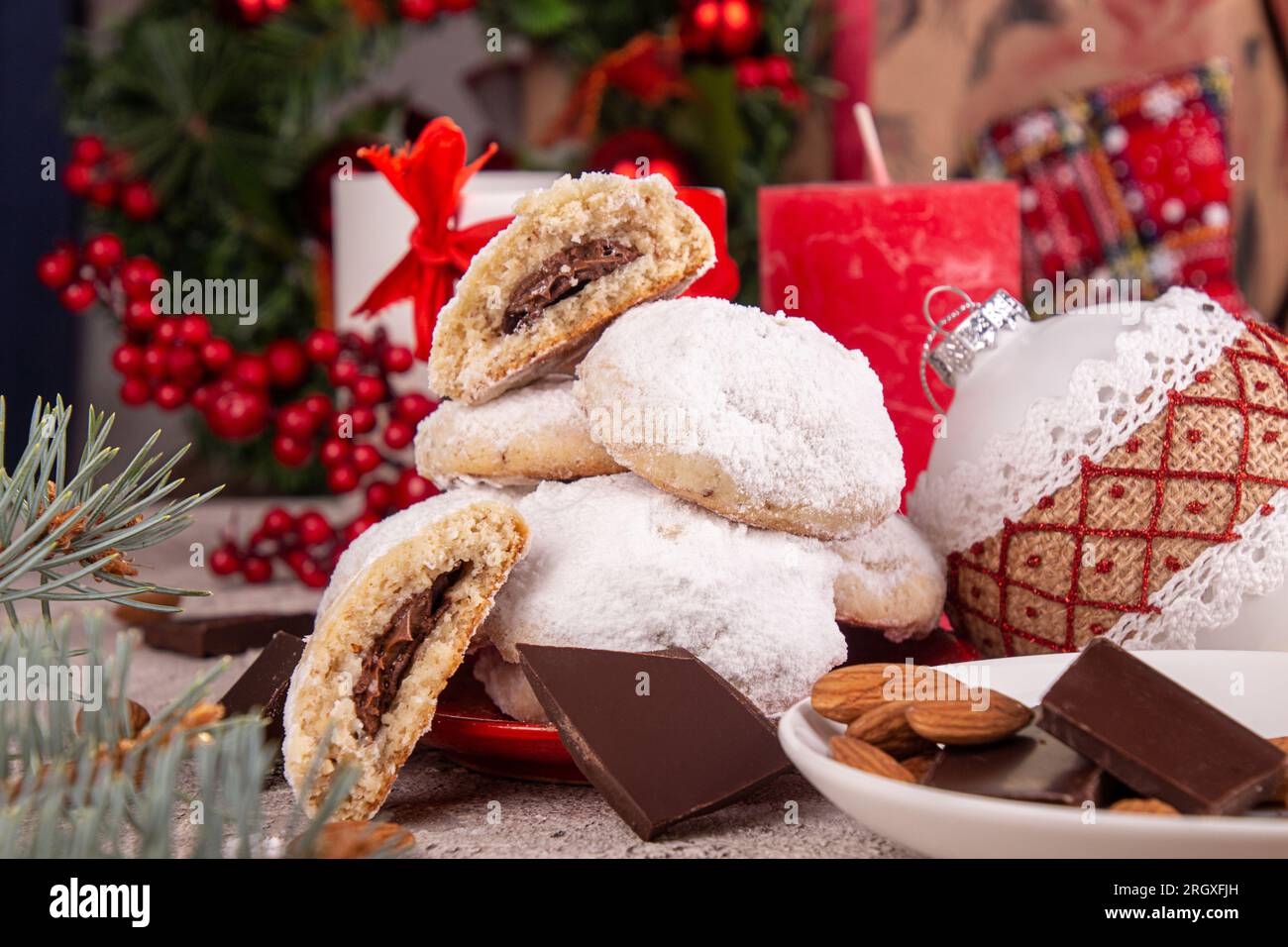 Traditional Christmas cookies biscuits snowballs covered icing sugar powder with almond nut stuffed with nutella chocolate. Russian Tea Cakes, Mexican Stock Photo