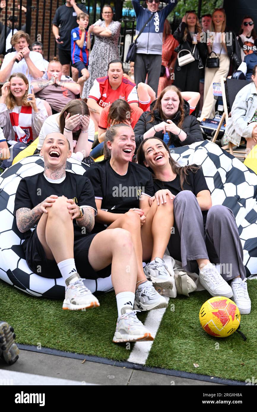EDITORIAL USE ONLY (left to right) Footballers Leah Galton, Maya Le Tissier and Anna Patten and attend a screening in St. Albans of the England vs. Columbia quarter final match of the FIFA Women's World Cup hosted by McDonalds, the official restaurant sponsor of the tournament. Picture date: Saturday August 12, 2023. Stock Photo