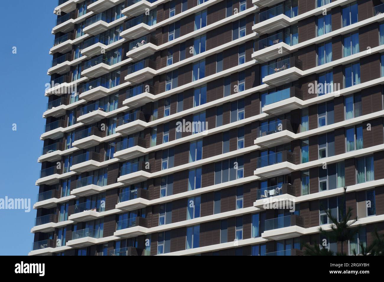 Tall Building with lots of balconies Stock Photo