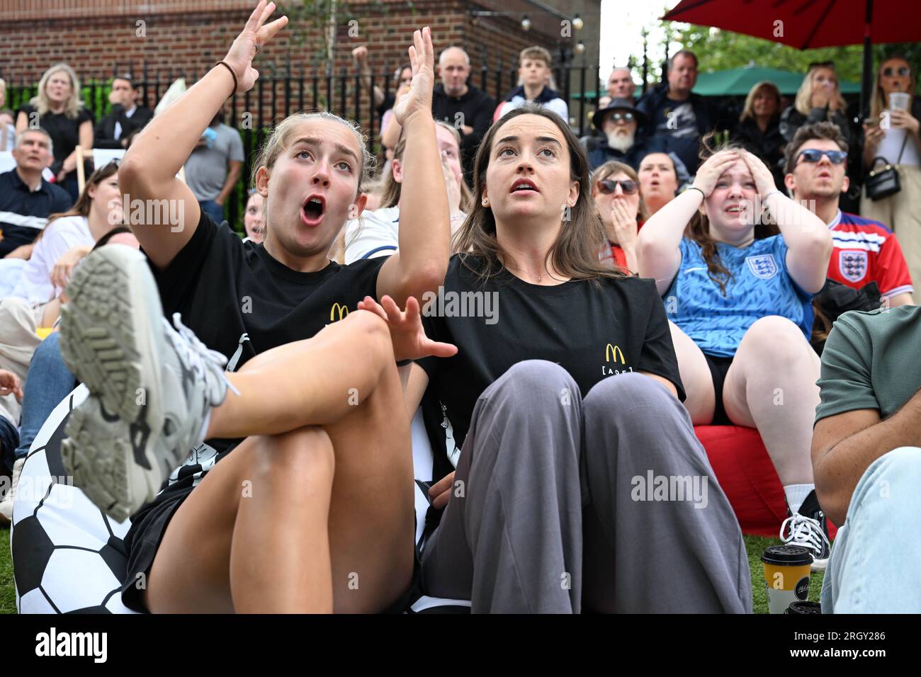 EDITORIAL USE ONLY (left to right) Footballers Maya Le Tissier and Anna Patten and attend a screening in St. Albans of the England vs. Columbia quarter final match of the FIFA Women's World Cup hosted by McDonalds, the official restaurant sponsor of the tournament. Picture date: Saturday August 12, 2023. Stock Photo
