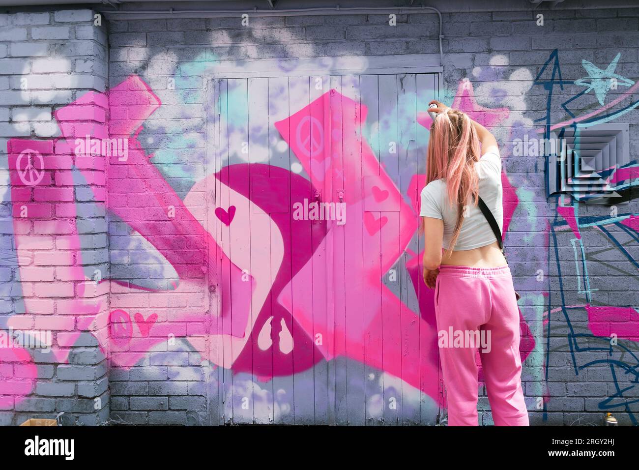 Birmingham, UK. 12th Aug, 2023. Graffiti artist 'DOLZ' wears Barbie ...
