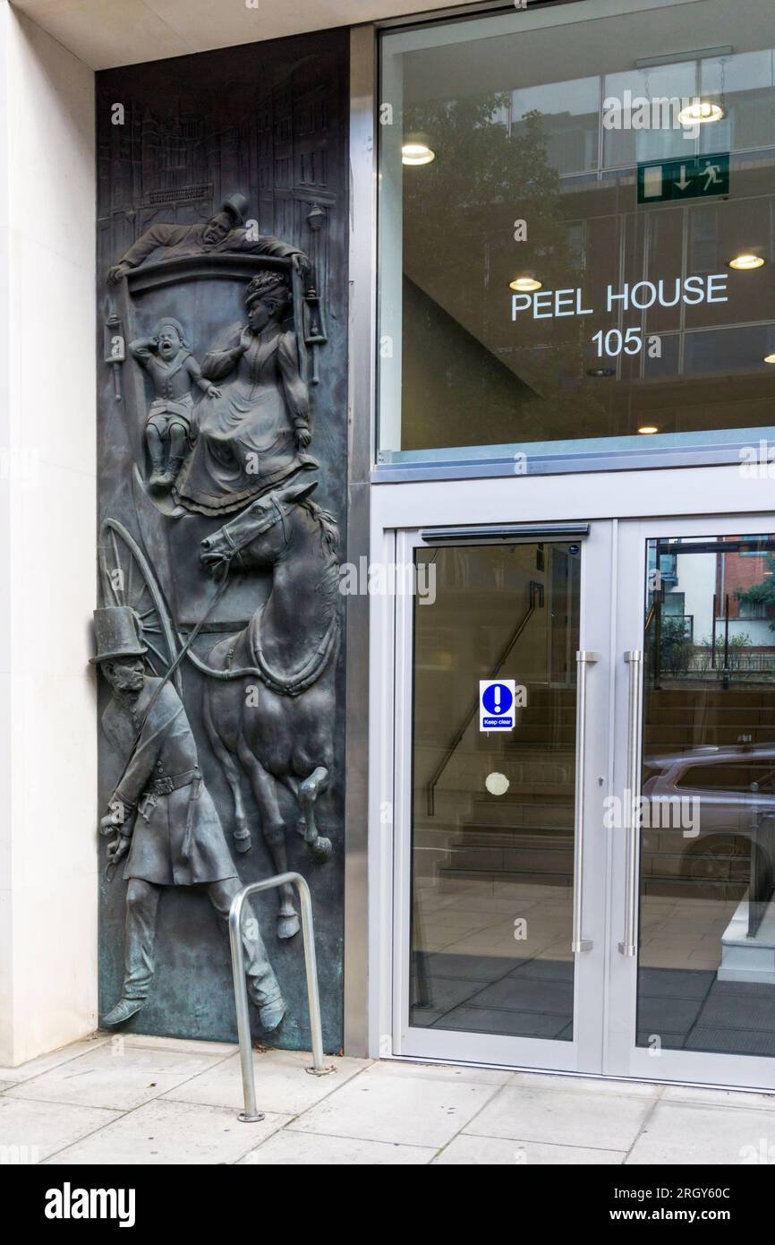 Bronze relief by Stuart Bamford Smith, 2009, at Peel House in Regency Street, Westminster; the site of the original Peelers training school. Stock Photo