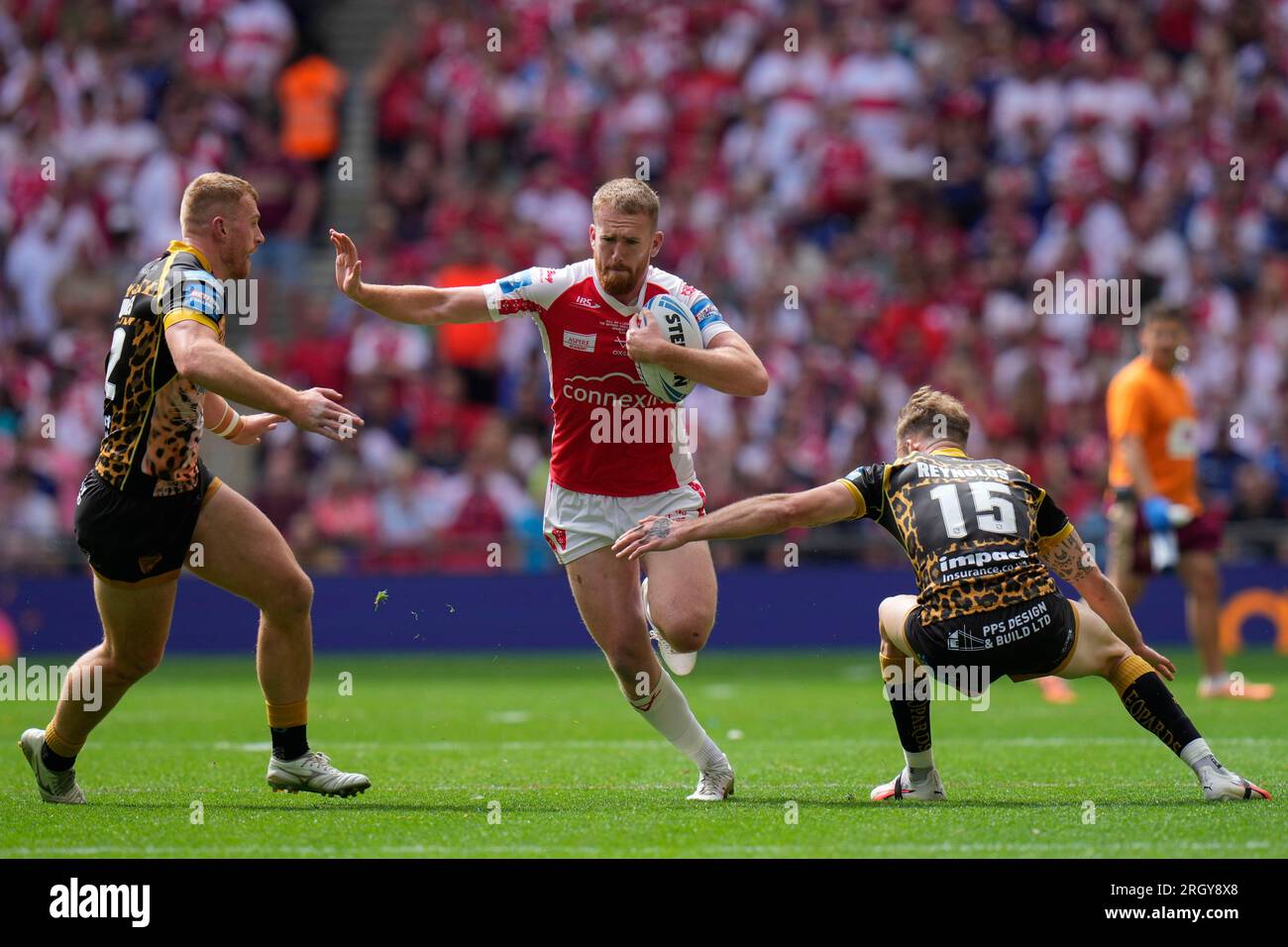Rowan Milnes #21 of Hull KR runs at the Leigh Leopards defence during ...