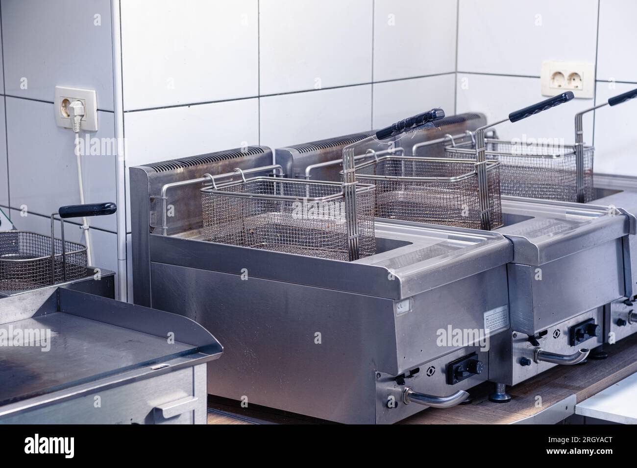 Equipment for deepfrying dishes. Industrial fryers in a restaurant