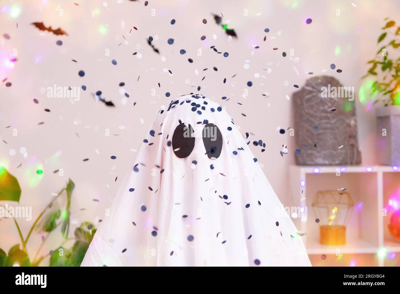 White ghost costume for Halloween party with neon lights in the