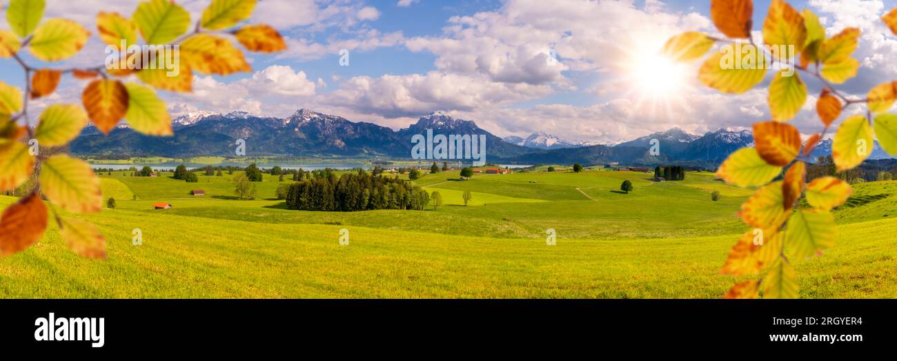 panoramic view to rural landscape with mountain range and lake at autumn Stock Photo
