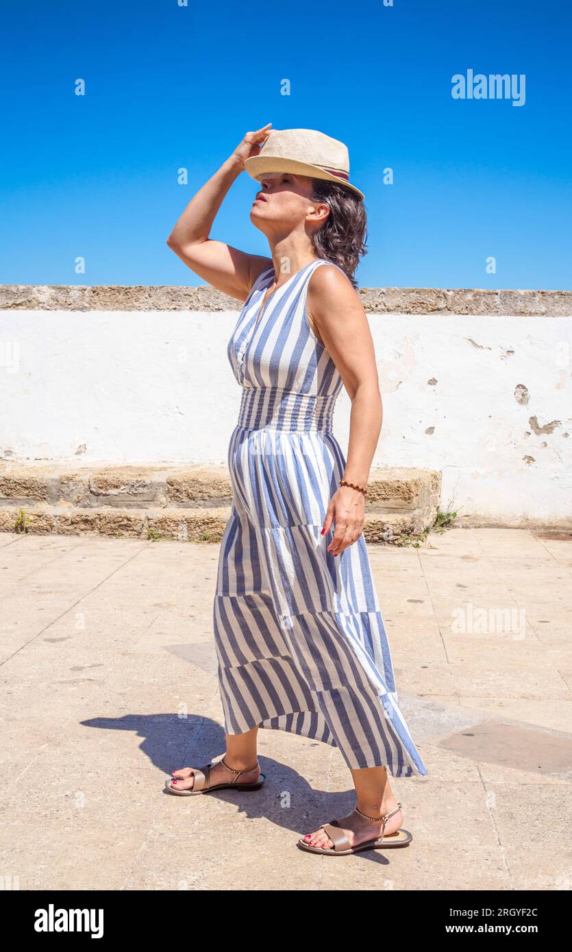 Woman summer dress walking hi-res stock photography and images - Alamy Woman summer dress walking hi-res stock photography and images - Alamy