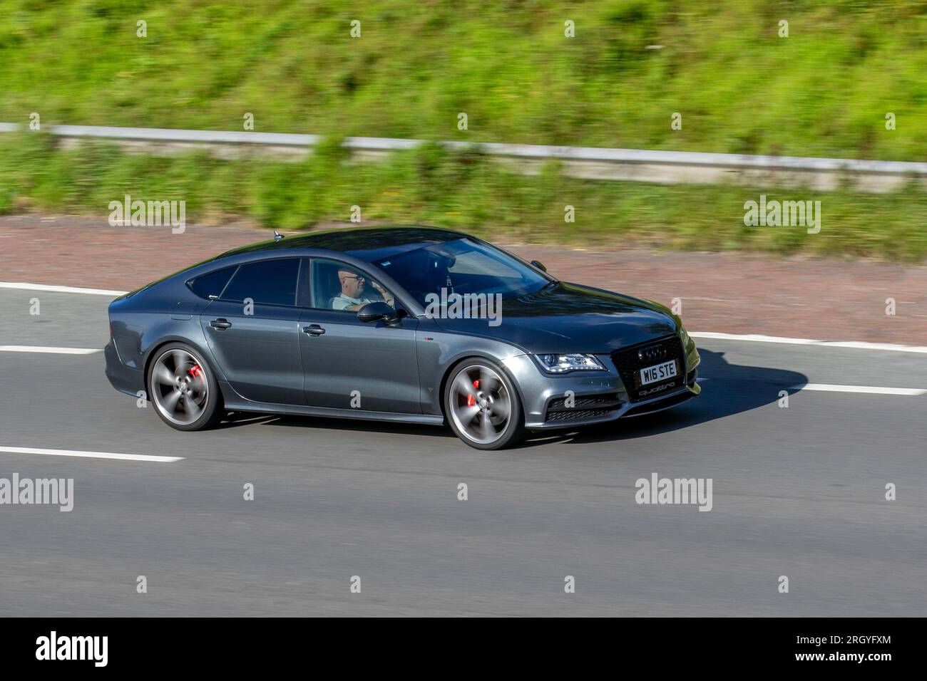 2013 A7 S Line Black Edit Tdi Qut A Tdi V6 245 Quattro S Tronic Auto Start/Stop Grey Car Hatchback Diesel 2967 cc  travelling at speed on the M6 motorway in Greater Manchester, UK Stock Photo