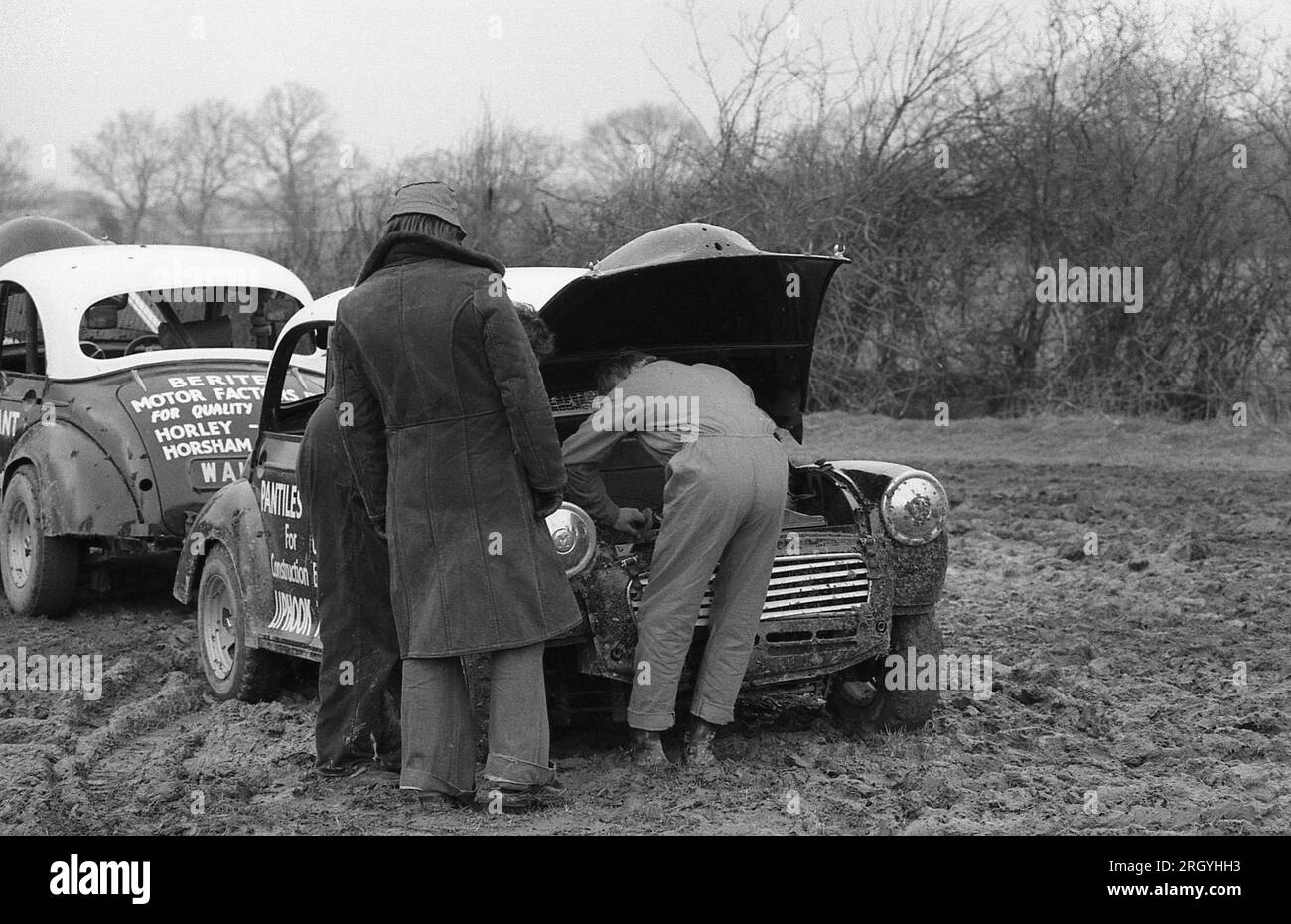Two Morris Minor cars at an autocross event at Smallfield in Surrey, England on March 6, 1977. The car was manufactured in the UK from 1948 to 1971. Stock Photo