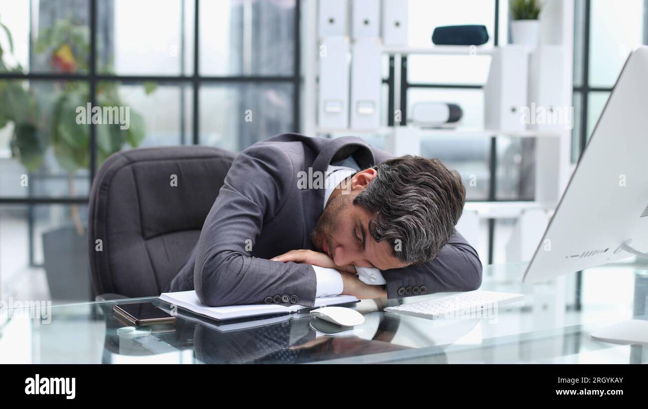 Sleeping, tired and business man in meeting for overworked, exhausted and stress. Stock Photo