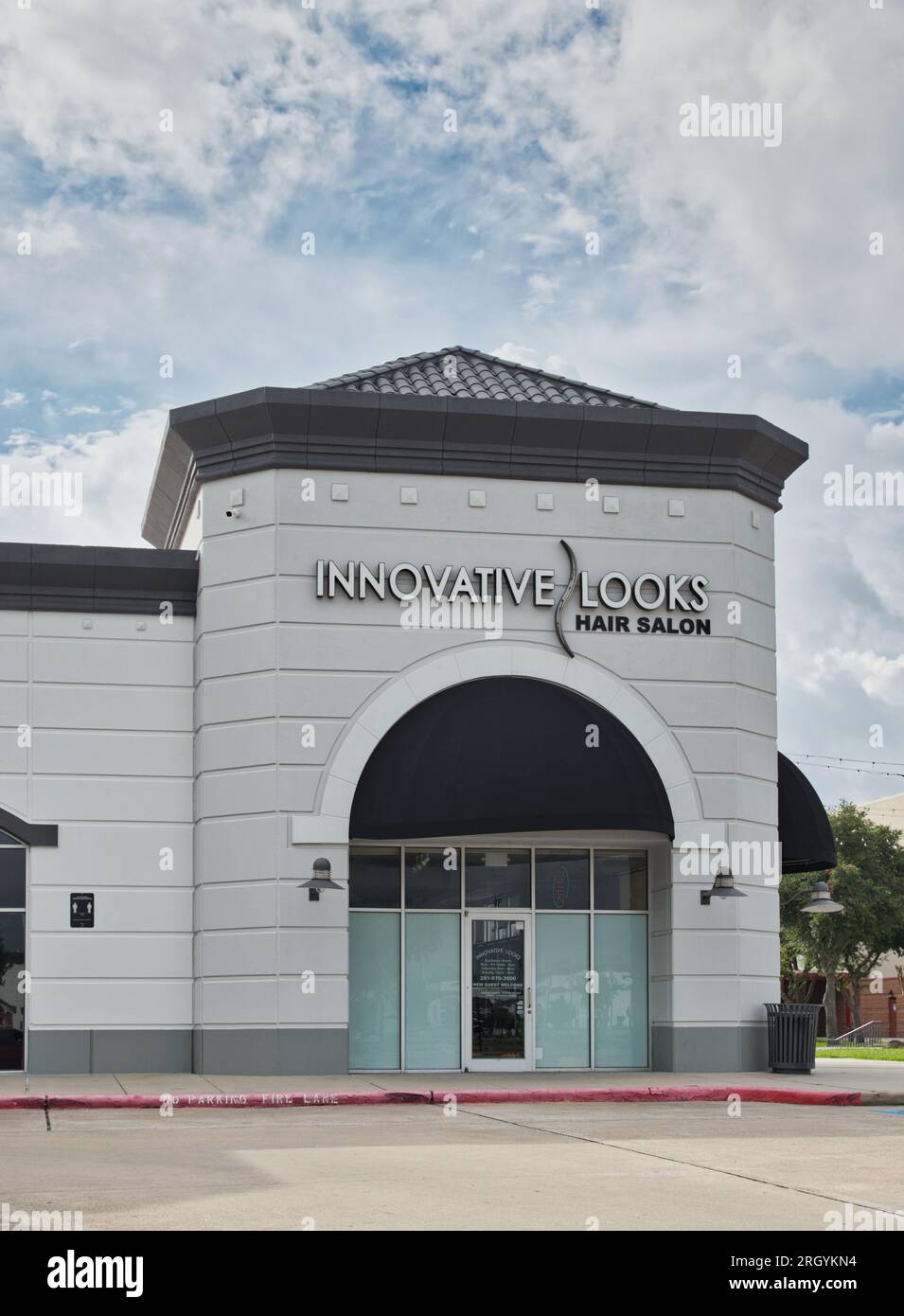 Houston, Texas USA 07-04-2023: Innovative Looks Hair Salon storefront exterior in Houston, TX. Local hairdresser business outside front view. Stock Photo