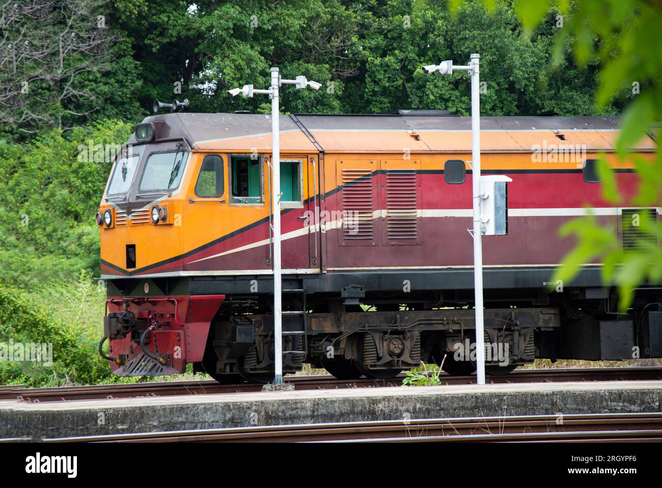 A train of diesel trains entering the platform Freight and passenger trains Stock Photo Alamy