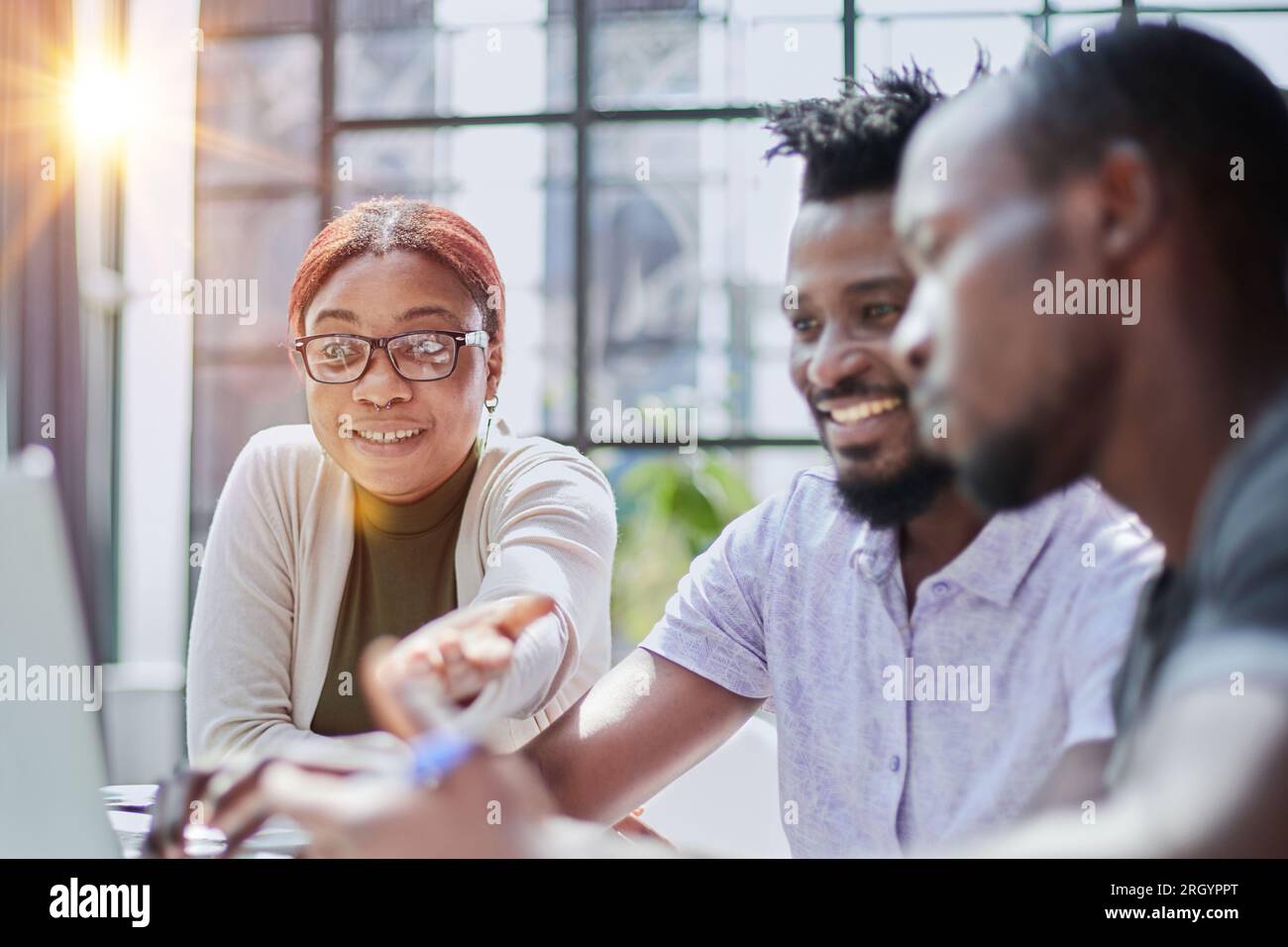Successful collaboration. Young business people in casual wear using modern technologies and working together on new project Stock Photo