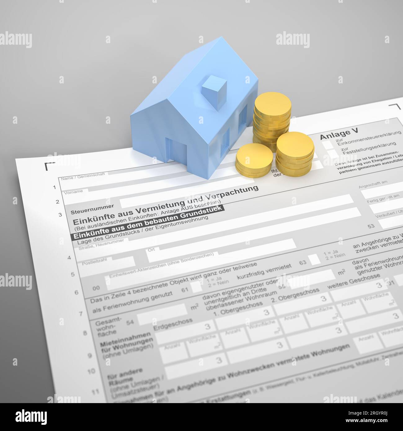 German tax for income from rent and lease  ('Vermietung und Verpachtung') concept. A house and a stack of coins on the form for the declaration of th Stock Photo