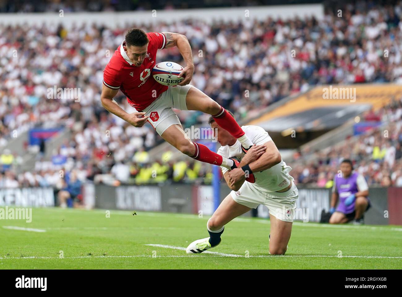 England's Freddie Steward tackles Wales' Josh Adams in the air and a penalty try is awarded to Wales on review during the Summer Nations Series match at Twickenham Stadium, London. Picture date: Saturday August 12, 2023. Stock Photo