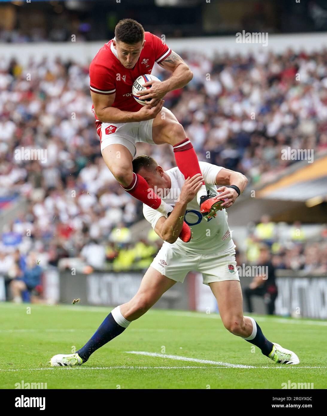 England's Freddie Steward tackles Wales' Josh Adams in the air and a penalty try is awarded to Wales on review during the Summer Nations Series match at Twickenham Stadium, London. Picture date: Saturday August 12, 2023. Stock Photo