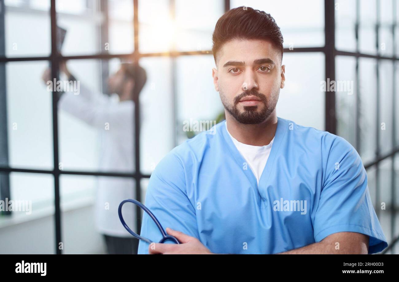 Friendly doctor posing lab coat hi-res stock photography and images - Alamy