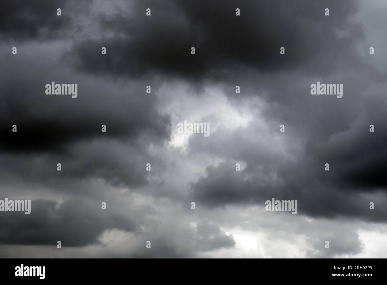 Dark grey clouds before a thunderstorm. Gloomy cloudy sky Stock Photo