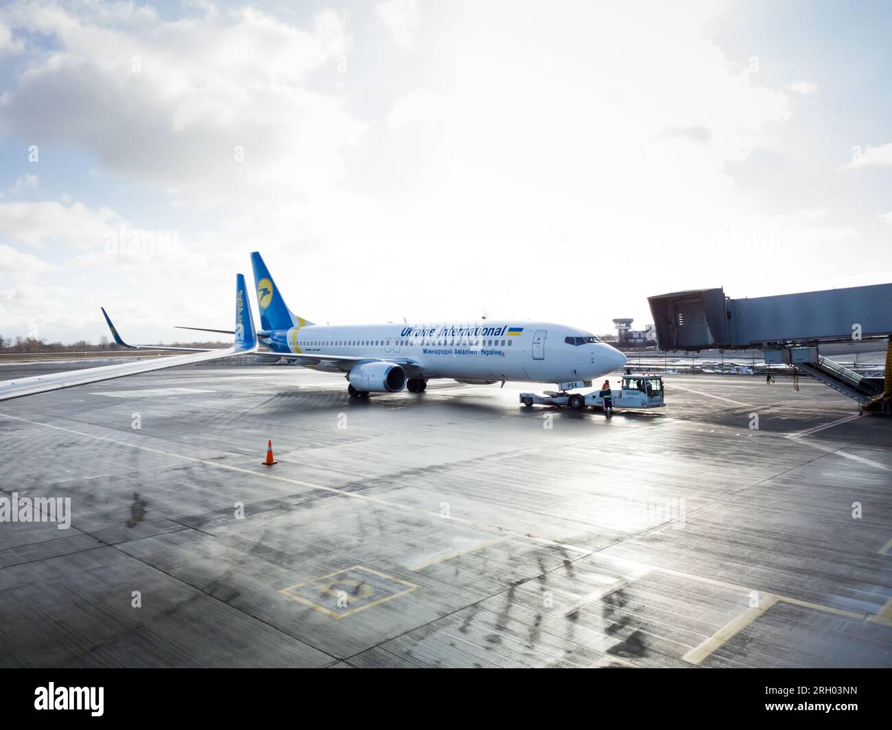 Kyiv, Ukraine - February, 7 2020: Crew of Ukraine International Airlines flight getting ready for boarding passengers. Boeing 737-200. Stock Photo